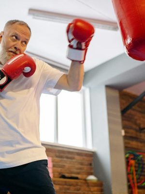 A Man Hitting the Heavy Bags