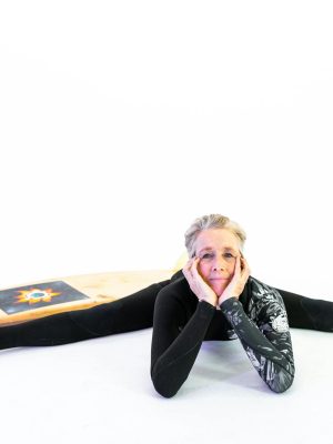 Woman in Black Active Wear With Legs Stretched On Floor